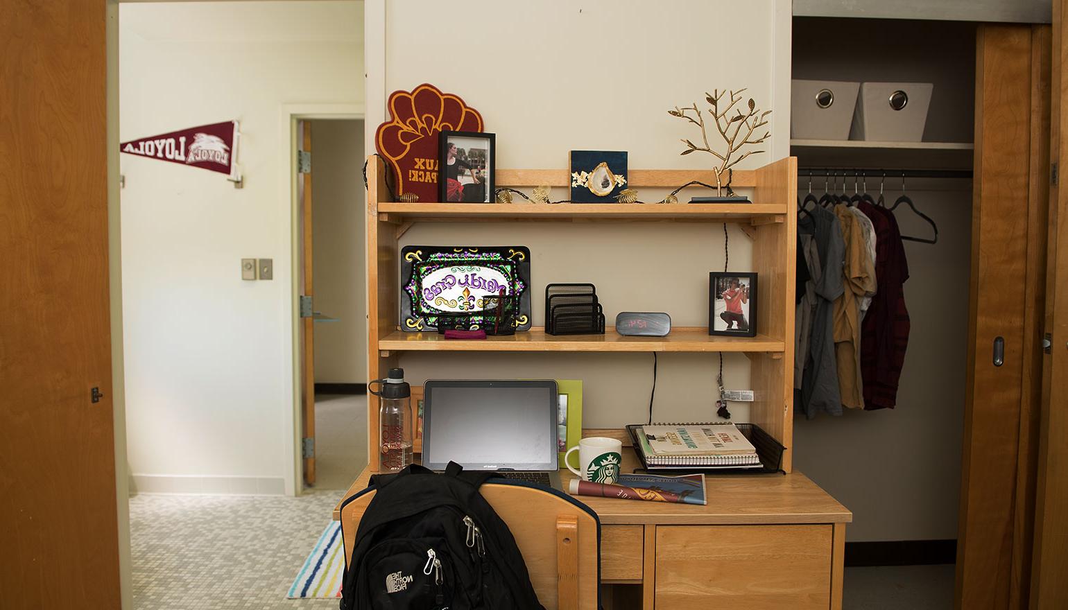 View of desk space and hallway in dorm